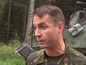 In this screengrab from video, Lt.-Col. Mason Stalker is interviewed as Canadian troops fight fires in Montreal Lake, Sask., on July 9, 2015.