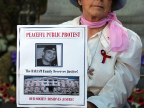 A protestor outside of the Wesley Hallam murder trial in Sault Ste. Marie, Ont., on July 28, 2016. (CHARLIE PINKERTON/SPECIAL TO THE SAULT STAR/POSTMEDIA NETWORK)