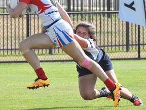 Belleville's Tia Svoboda breaks a tackle during play at the 2016 North American Invitational Sevens rugby championships, held recently in Salt Lake City. (Rugby Canada photo)