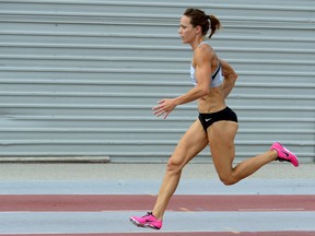 Canadian track athlete and two-time Olympian Jessica Zelinka trains at TD Waterhouse stadium in London this week. Zelinka is launching Sprintfit, a clinic to teach fundamentals of a proper warmup and the safe mechanics of sprinting. (MORRIS LAMONT, The London Free Press)