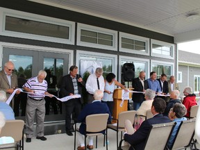 The Cochrane District Social Services Administration Board (CDSSAB) held their official opening of the Cochrane Retirement Living Complex. Those cutting the ribbon were Cliff Wilson (left to right) Denis Vallee, MP John Vanthof, MPP Charlie Angus, Lee-Ann St. Jacques, Mayor Peter Politis, Dave Landers, Brian Marks and David Butler.