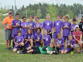 The LAC Spartans with their trophies for coming second in the highest league soccer for their age group in Georgetown.