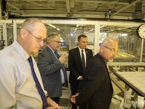 Jason Miller/The Intelligencer
Strathcona Energy CEO Karl Hollett takes Hastings County Warden Rick Phillips, MP Neil Ellis and Mayor Taso Christopher on a tour of the Sidney Street manufacturing facility last week.