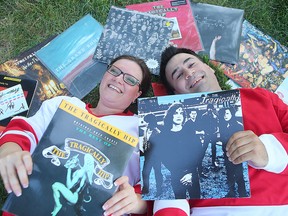 Veronica Gagnon (l) and Beau Downey display some of their Tragically Hip collection in Winnipeg, Man. Tuesday August 02, 2016.