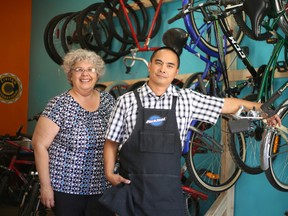 Tyla Vrantsidis and Dave Vinluan are helping equip kids in the Napanee community with bicycles — for free. (Meghan Balogh/Postmedia Network)