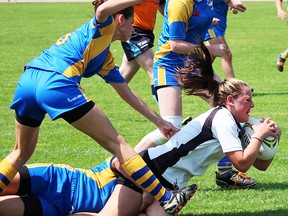 Emily Babcock scores a try for the Belleville Bulldogs senior women's rugby team last season at MAS Park. The QSS grad has been named to the Team Canada U20 women's national team for a three-match tour to England later this month. (Intelligencer file photo)
