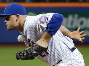 New York Mets first baseman Lucas Duda gets in front of a bad throw to first during a game against the San Francisco Giants Friday, April 29, 2016, in, New York. (AP Photo/Julie Jacobson)