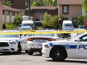 Peel police on the scene of a homicide on Fleetwood Crescent in Brampton on Wednesday, August 3, 2016. (Michael Peake/Toronto Sun)