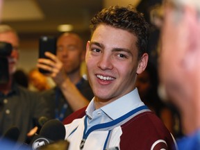 Tyson Jost, the first-round draft pick of the Colorado Avalanche, talks to reporters at a news conference in the team’s locker room Monday, June 27, 2016, in Denver. (AP Photo/David Zalubowski)