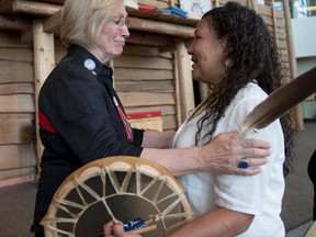Indigenous Affairs Minister Carolyn Bennett embraces Ceejai Julian, who lost two sisters, following the announcement of the inquiry into Murdered and Missing Indigenous Women at the Museum of History in Gatineau, Que., in this file photo. The federal government has announced the terms of a long-awaited inquiry into murdered and missing indigenous women, unveiling that it will need at least $13.8 million more for the study than was originally expected. THE CANADIAN PRESS/Justin Tang