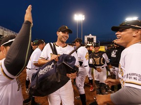 Edmonton players celebrate winning Game 4 and their Western Major Baseball League playoff semifinal series between the Edmonton Prospects and the Okotoks Dawgs at Telus Field in Edmonton on August 3, 2016.