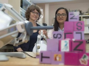 Kim Adams and Alejandra Ruiz at the University of Alberta Assistive robotics research lab demonstrated how robots can help children with physical disabilities on August 3, 2016 in Edmonton. Photo by Shaughn Butts/EDMONTON JOURNAL