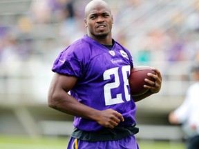 Minnesota Vikings running back Adrian Peterson runs with the ball during the first day of NFL training camp at Mankato State University in Mankato, Minn. on July, 29, 2016. (AP Photo/Andy Clayton-King)