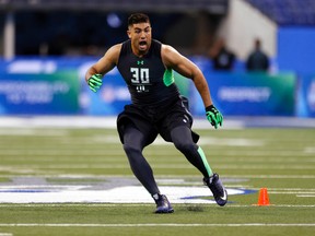 Brigham Young Cougars defensive lineman Bronson Kaufusi participates in workout drills during the 2016 NFL Scouting Combine at Lucas Oil Stadium. (Brian Spurlock-USA TODAY Sports)