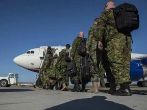About 30 soldiers from the 3rd Canadian Division departed the Executive Flight Centre in Edmonton on August 3, 2016 for a six month deployment to Ukraine. SHAUGHN BUTTS / EDMONTON JOURNAL