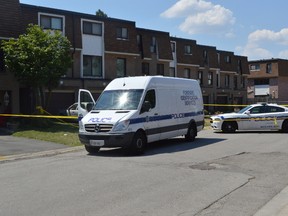 A Peel Regional Police forensic vehicle in front of the Fleetwood Cres. home where a man was murdered on Wednesday. (Aaron D'Andrea/Toronto Sun/Postmedia Network)