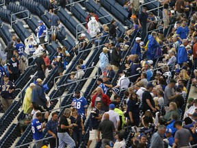 Winnipeg Blue Bombers fans leave the stadium during a weather delay prior to the start of the Bombers/Tiger-Cats game in Winnipeg, Man. Wednesday August 03, 2016.Brian Donogh/Winnipeg Sun/Postmedia Network