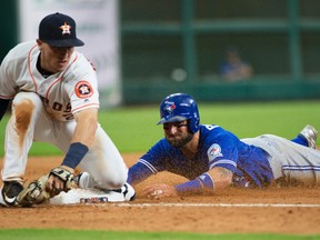 Toronto Blue Jays’ Kevin Pillar, right, slides safely into third, next to Houston Astros third baseman Alex Bregman Thursday, Aug. 4, 2016, in Houston. (AP Photo/George Bridges)