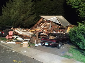 The front of a house that exploded is seen on East Street in Vernon, Conn., Thursday, Aug. 4, 2016. Connecticut authorities say an explosion has destroyed a house in the north-central part of the state, and officials say seven people, including a young child, have been taken to hospitals. The cause of the blast isn't known. (David Owens/Hartford Courant via AP)