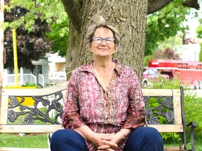 Lucknow resident Pat Weptler sits underneath her large tulip tree. When she moved in three years ago, she thought it was nothing more than a deformed maple, but once learning its true identity and that it is not indigenous to this area she has been its biggest supporter hoping for it to become a local landmark.