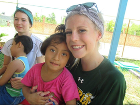 Natalie Eklund with Sandra in Merida, Mexico this summer. Sandra is the daughter of one of the ladies who would bring the humanitarian group lunch at the work site. Sandra loved to come and sit with the volunteers and have them spin her around - Photo submitted.