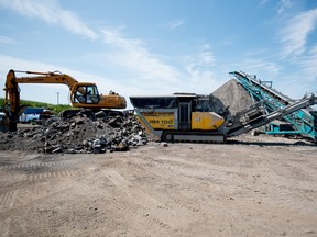 A concrete crusher recycles concrete at Delta Remediation in Acheson on Tuesday, Aug. 2, 2016. Delta Remediation owner Robert Lacey has applied and been successful in receiving grants from the provincial government to further the training of his employees - Photo by Yasmin Mayne.