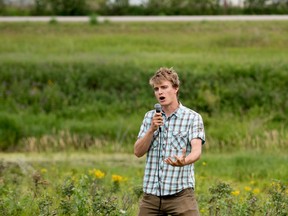 Luke Wonneck, agroforestry technician for Agroforestry and Woodlot Extension Society (AWES) speaks about an eco-buffer he helped plant at the Edmonton Corn Maze in partnership with ALUS during a press conference in Parkland County on Thursday, July 28, 2016 - Photo by Yasmin Mayne.