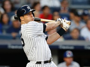 New York Yankees' Mark Teixeira watches his three-run home run off New York Mets starting pitcher Steven Matz during the second inning of a baseball game Aug. 3, 2016, in New York. (AP Photo/Kathy Willens)