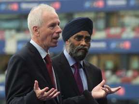 Canadian Minister of National Defence Minister Harjit Sajjan listens as Foreign Affairs Minister Stephane Dion responds to a question during an interview at the NATO summit in Warsaw, Poland on July 9, 2016. Canada's army has the ability to simultaneously help its NATO allies deter Russia on Europe's eastern border while launching a substantial United Nations peacekeeping mission, top military officials and leading experts say. The government's decision last week to contribute 450 soldiers, light armoured vehicles and other equipment to Latvia to a 1,000-strong multinational NATO force has raised questions about whether the Canadian Forces can still make good on mounting a major UN peacekeeping mission - a core foreign policy goal of the Trudeau Liberals. Defence Minister Sajjan and Foreign Affairs Dion insist the answer is yes. THE CANADIAN PRESS/Adrian Wyld