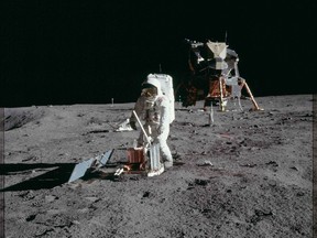 Astronaut Edwin E. Aldrin Jr., lunar module pilot, deploys a scientific research package on the surface of the moon near the Lunar Module (LM) "Eagle" during the Apollo 11 extravehicular activity (EVA) in this July 20, 1969 NASA handout photo. (REUTERS/NASA/Handout via Reuters)