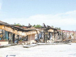 More than a month after a fire ravaged this plaza on Hyde Park Road, it still stands as a grim reminder of the slow process of recovery. (DEREK RUTTAN, The London Free Press)