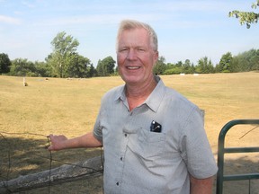 Patrick Shannahan, from Idaho, stands in front of the course at the Kingston Sheep Dog Trials, in Kingston, Ont. on Friday, August 5, 2016. Shannahan is one of the judges at the annual event, now the largest such trial in North America. Michael Lea The Whig-Standard Postmedia Network