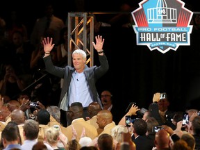 Brett Favre waves to the crowd at the Pro Football Hall of Fame enshrinees' dinner on Aug. 4, 2016, in Canton, Ohio. (Scott Heckel/The Canton Repository via AP)
