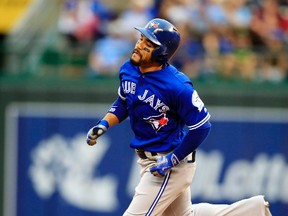 Blue Jays' Devon Travis rounds the bases after hitting a solo home run off Royals pitcher Dillon Gee during first inning MLB action at Kauffman Stadium in Kansas City, Mo., on Friday, Aug. 5, 2016. (Orlin Wagner/AP Photo)