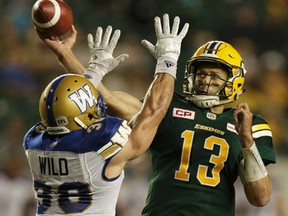 Eskimos quarterback Mike Reilly attempts a pass in the second half against the Winnipeg Blue Bombers at Commonwealth Stadium in Edmonton, on Thursday, July 28, 2016.
