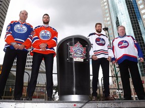 Edmonton Oilers alumnus Dave Semenko, Oilers goaltender Cam Talbot, Winnipeg Jets forward Blake Wheeler and Jets alumnus Thomas Steen show off the Heritage Classic jerseys as the National Hockey League announce the rosters at a Tim Hortons NHL Heritage Classic press event at Winnipeg's Portage and Main intersection on Friday, August 5, 2016.