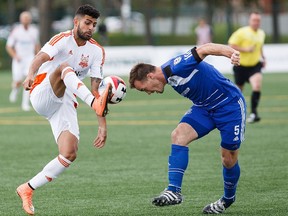 Edmonton's Albert Watson, right, tries to head the ball away from Carolina's Aly Alberto Hassan during NASL soccer action between FC Edmonton and the Carolina RailHawks at Clarke Stadium in Edmonton, Alta., on Sunday, July 31, 2016. FC Edmonton travel to play Puerto Rico FC on Saturday.