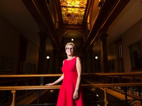 Ontario Premier Kathleen Wynne poses for a photographer at Queen's Park in Toronto on Friday, August 5, 2016. THE CANADIAN PRESS/Nathan Denette