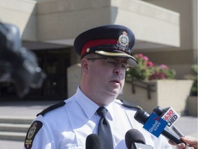 Edmonton Police Service Insp. Dan Jones speaks to the media Friday, Aug. 5, 2016, in front of police headquarters about an incident involving Bashir Mohamed who said a motorist used racial slurs during a confrontation. Police said no charges will be laid.