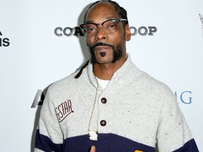 FILE- In this May 16, 2016, file photo, Snoop Dogg arrives at the LA Premiere of "Coach Snoop" at the TCL Chinese 6 Theatres in Los Angeles. Authorities say multiple people have been hurt after a railing collapsed during an outdoor concert by Snoop Dogg and Wiz Khalifa in southern New Jersey on Friday, Aug. 5. (Photo by Rich Fury/Invision/AP, File)