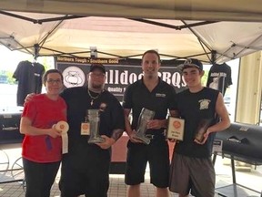 Rob Turner is headed to the world championship barbecue competition in Kansas City after being named grand champion in Kenora in May. Here is with his wife Brigitte (far left) and stepson Nicholas (far right).