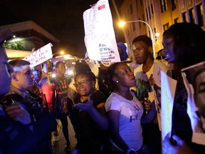 Demonstrators confront police officers as they protest the fatal police shooting of Paul O'Neal on August 5, 2016 in Chicago, Illinois. O'Neal, an unarmed 18-year-old man was shot and fatally wounded July 28, when Chicago Police officers tried to arrest him for allegedly stealing a Jaguar car from the suburbs. The Chicago Police department released videos of the shooting to the public and media, which was captured by body cameras and dashboard cameras. (Photo by Joshua Lott/Getty Images)