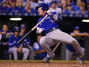 Blue Jays batter Josh Donaldson reacts after being struck by a pitch from Kelvin Herrera of the Royals during the ninth inning at Kauffman Stadium in Kansas City, Mo., on Friday, Aug. 5, 2016. (Ed Zurga/Getty Images)