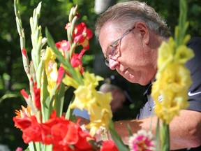 Prince Edward County Mayor Robert Quaiff quickly puts together a floral arrangement as part of a contest against his Quinte West counterpart, Mayor Jim Harrison during Walt's Sugar Shack Shindig on Saturday August 6, 2016 in Prince Edward County, Ont. The event was a fundraiser for the Prince Edward County Memorial Hospital Foundation(PECMHF). Tim Miller/Belleville Intelligencer/Postmedia Network