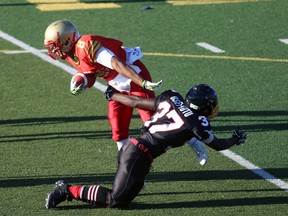 Josh Wright of the Sarnia Imperials breaks a tackle from Oakville Longhorn Sammy Osei-Tutu during the teams' Northern Football Conference quarter-final at Norm Perry Park on Saturday, Aug. 6, 2016 in Sarnia, Ont. Sarnia won 56-0 to advance to next week's semifinals. (Terry Bridge/Sarnia Observer/Postmedia Network)