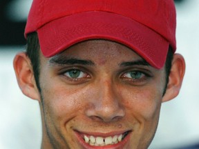 In an Oct. 4, 2007 file photo, Bryan Clauson smiles after winning the pole for Friday's ARCA RE/MAX Series 250 auto race, at Talladega Superspeedway in Talladega, Ala. (AP Photo/Glenn Smith, File)