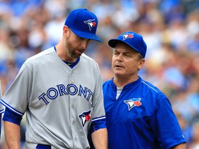 Toronto Blue Jays manager John Gibbons talks with relief pitcher Scott Feldman, who leaves in the seventh inning of a game against the Kansas City Royals in Kansas City, Mo., on  Aug. 7, 2016. (AP Photo/Orlin Wagner)