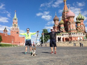 Nikolai Pavlov, puppy Pastushok (@pastushok_the_dog) and life-long friend Alex Vigandt in front of St. Basil's Cathedral on Red Square in Moscow on May 12. The pair, along with Nikolai's sister, Yara and Vancouver Island's Andrew Boogaards are cycling across Russia. Photo supplied.