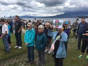 Protesters gather at Vanier Park to speak out against the construction of the Site C dam along the Peace River in northeastern B.C., in Vancouver on Saturday, July 9, 2016. (THE CANADIAN PRESS/Linda Givetash)