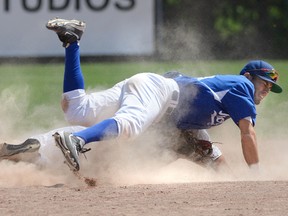 Guelph Royals shortstop Kingsley Alarcon tumbles over RJ Fuhr after tagging out the London Majors runner at second base during the fifth inning of Game 3 of the Intercounty Baseball League quarterfinal at Labatt Park on Sunday. The Majors won 8-5 to go ahead 3-0 in the series. (MORRIS LAMONT, The London Free Press)